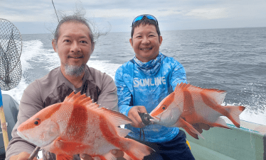 Bottom fishing at Tioman, Malaysia. Red emperor (ang sai) caught using live fish bait.