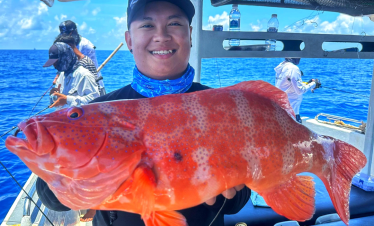 Bottom fishing at Rompin, Malaysia. Coral trout (ang gao) caught using jig at coral reef spot.