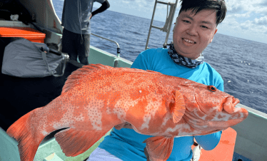 Bottom fishing at Tioman, Malaysia. Coral trout (ang gao) caught using live fish bait.